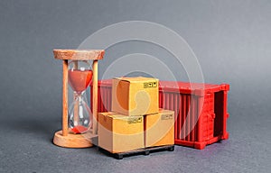 Red container with cardboard boxes and an hourglass. Express delivery in short time concept. Temporary storage, limited offer