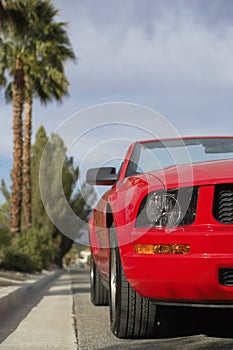 Red Convertible Parked By Curb