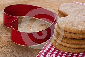 Red cookie cutter and homemade gingerbreads