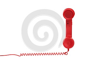 Red corded telephone handset on white background. Hotline concept