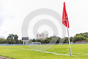 Red corner flag of soccer field