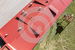 Red corrugated metal roof. aerial overhead view