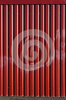 Red corrugated metal sheet.