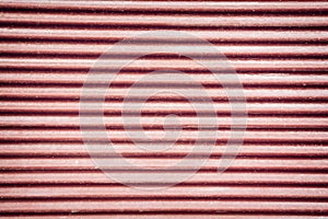 Red corrugated metal sheet