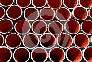 Red corrugated pipes for laying electric cables