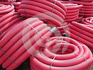 Red corrugated plastic pipes used for underground electrical lines