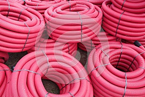 Red corrugated plastic pipes used for underground electrical lines