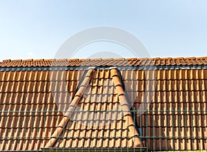 Red corrugated tile element of roof at house, Shingles roofing surface tiles overlay pattern