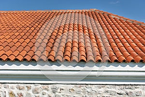 Vibrant Roof Design: Red Corrugated Tiles Enhancing Modern House Aesthetics