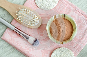 Red cosmetic clay powder in the small onyx bowl. Homemade beauty mask for skin and hair.