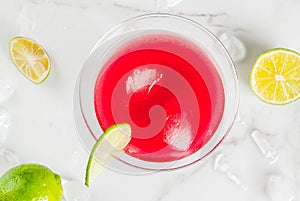 Red cosmopolitan cocktail with lime