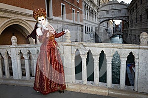 Red costumed masked woman