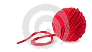 Red cotton yarn ball on white