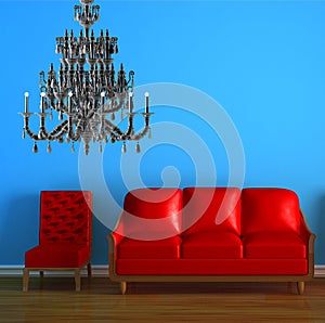 Red couch and chair with chandelier