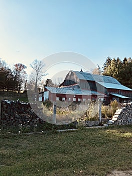 Red Country Barn with Blue Sky Background