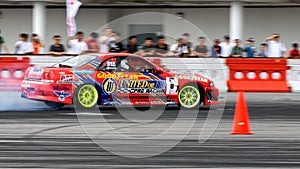 Red coupe drifting during Formula Drift Singapore