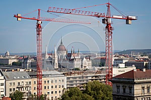 Red cranes on a blue sky. Construction in Budapest