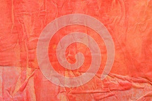 Red creased tissue paper bacground texture