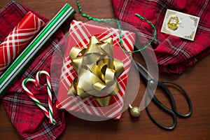Red cristmas gift with huge golden ribbon on top