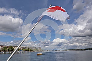 Red cross flag and the harbor of Geneva
