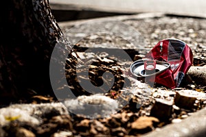 Red crushed soda can thrown away