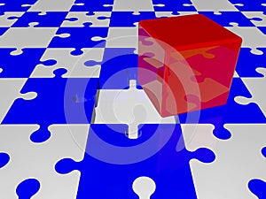 Red cube on puzzle pieces in blue and white colors