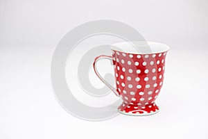 Red cup with dots. isolated