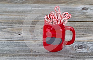Red Cup filled with Candy Canes for the holiday season