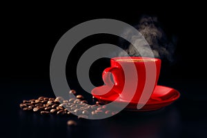 Red cup of hot black coffee with steam and coffee beans on dark background. Low key. Copy space