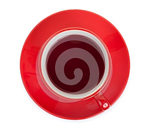 Red cup on a red saucer with red tea, isolated on a white background, top view