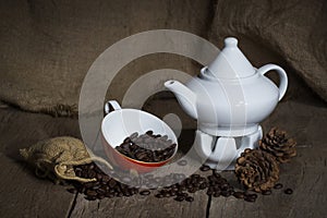 Red cup, Teapots and Coffee beans on wooden