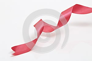 Red curly ribbon on white