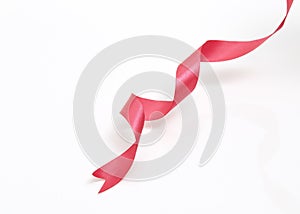 Red curly ribbon on white