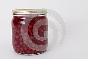 Red currant in a glass jar
