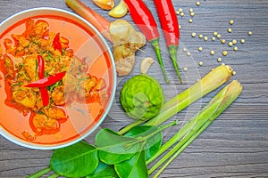 Red curry chicken, Thai Spicy food and fresh herb ingredients on photo
