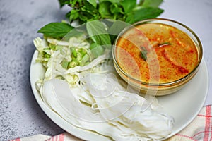 Red curry cuisine asian food on the table - Thai food curry soup bowl with thai rice noodles vermicelli ingredient herb vegetable