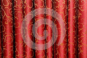 Red curtain with floral ornament