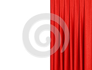 Red curtain on theater or cinema stage slightly open