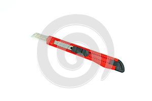 Red cutter knife isolated on white background, construction and home DIY