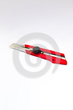 Red Cutter Knife isolated on white background. Cutter stock photo