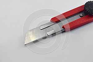 Red cutter knife isolated on white background
