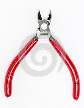 Red cutting plier on white