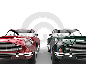 Red and dark green metallic vintage cars - front view - cut shot