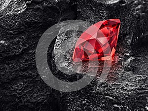 Red dazzling diamond on black coal background