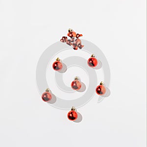 Red decoracion balls with shadow on white background. Top view. Flat lay