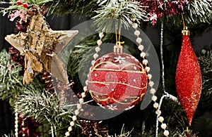 Red decoration on Christmas tree.