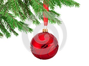 Red decorations Christmas ball hanging on a fir tree branch