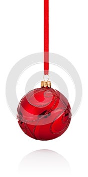 Red decorations Christmas ball hanging on ribbon Isolated