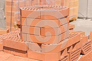 Red decorative bricks with bevelled angle on an outdoor warehouse