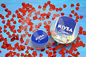 Nivea cream product and red hearts blue background